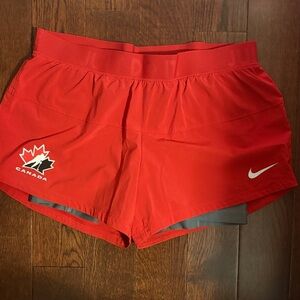 Nike Women's Red Athletic Shorts with Canada Logo